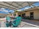 Outdoor patio area with shaded pergola and comfortable outdoor seating at 855 S Revolta Cir, Mesa, AZ 85208