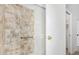 Bathroom shower featuring tile surround, glass door, and metallic fixtures at 855 S Revolta Cir, Mesa, AZ 85208
