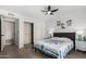 Bedroom with closet and an elegant quilt and ceiling fan at 855 S Revolta Cir, Mesa, AZ 85208