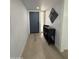 Welcoming entryway featuring neutral tones, wood floors, and a stylish console table with decorative accents at 855 S Revolta Cir, Mesa, AZ 85208