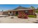 Charming home with brick accents and desert landscaping in the front yard at 855 S Revolta Cir, Mesa, AZ 85208