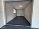 Tidy garage offering a clean, painted floor and a window for natural light at 855 S Revolta Cir, Mesa, AZ 85208