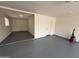 This garage offers both a clean epoxy floor and storage space for an organized and functional area at 855 S Revolta Cir, Mesa, AZ 85208