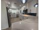 Spacious kitchen featuring modern appliances, quartz countertops, and white cabinets at 855 S Revolta Cir, Mesa, AZ 85208