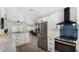 Bright, open kitchen features stainless steel appliances, white cabinets, and a modern backsplash at 855 S Revolta Cir, Mesa, AZ 85208