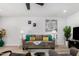 Cozy living room features neutral tones, comfortable seating, and a bright, inviting atmosphere at 855 S Revolta Cir, Mesa, AZ 85208