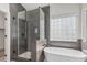 Bathroom featuring a modern soaking tub and a glass enclosed shower at 862 W Rawhide Ave, Gilbert, AZ 85233