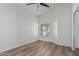 Bedroom with wood floors, ceiling fan and large window bringing in natural light at 862 W Rawhide Ave, Gilbert, AZ 85233