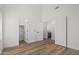 Bright bedroom with wood floors, open doorways leading to the closet and bathroom at 862 W Rawhide Ave, Gilbert, AZ 85233