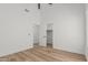 Bright bedroom featuring wood floors and access to a walk-in closet at 862 W Rawhide Ave, Gilbert, AZ 85233