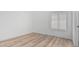 Bedroom with wood flooring and a window at 862 W Rawhide Ave, Gilbert, AZ 85233