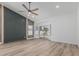 Modern bedroom featuring a decorative wall, wood flooring and lots of natural light at 862 W Rawhide Ave, Gilbert, AZ 85233