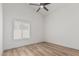 Bedroom with neutral walls, ceiling fan, and window at 862 W Rawhide Ave, Gilbert, AZ 85233
