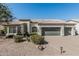 Beautiful single-story home with well-maintained landscaping and a three-car garage at 862 W Rawhide Ave, Gilbert, AZ 85233
