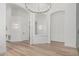 Elegant foyer with an open floor plan and stylish lighting at 862 W Rawhide Ave, Gilbert, AZ 85233