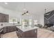 Open-concept kitchen with a view of the backyard and a cozy living area at 862 W Rawhide Ave, Gilbert, AZ 85233