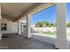 Covered patio with view of green grass and block fence for extra privacy at 862 W Rawhide Ave, Gilbert, AZ 85233