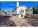 Exterior home view highlighting the backyard with stone pavers and desert landscaping at 921 S Val Vista Dr # 135, Mesa, AZ 85204