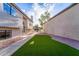 Backyard area featuring an easy to maintain artificial lawn at 921 S Val Vista Dr # 135, Mesa, AZ 85204