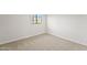 Bright bedroom featuring neutral carpeting, a window, and clean, white walls at 921 S Val Vista Dr # 135, Mesa, AZ 85204