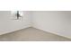Bright bedroom featuring neutral carpeting, a window, and clean, white walls at 921 S Val Vista Dr # 135, Mesa, AZ 85204