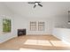 Well-lit living room featuring a fireplace, light colored hardwood floors, and bright, sunny windows at 921 S Val Vista Dr # 135, Mesa, AZ 85204