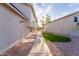 Side yard featuring gravel landscaping and small decorative lawn at 921 S Val Vista Dr # 135, Mesa, AZ 85204
