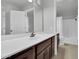 Spacious bathroom featuring white countertops, dark cabinets, and a separate shower-tub space at 1001 N Pasadena Dr # 105, Mesa, AZ 85201