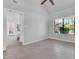 Open-concept bedroom featuring neutral color walls, tiled flooring, and natural light through the window at 1001 N Pasadena Dr # 105, Mesa, AZ 85201