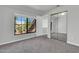 Bedroom featuring a window, mirrored closet, and doorway to an additional space at 1001 N Pasadena Dr # 105, Mesa, AZ 85201