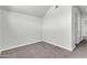 A cozy bedroom with neutral walls and plush carpeting awaits personal touches at 1001 N Pasadena Dr # 105, Mesa, AZ 85201