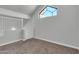 An empty bedroom features a unique window and neutral walls, ready for personalization at 1001 N Pasadena Dr # 105, Mesa, AZ 85201