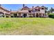 Charming two-story home featuring a well-manicured lawn, neutral color palette, and a private balcony at 1001 N Pasadena Dr # 105, Mesa, AZ 85201