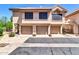 Charming townhome featuring a tile roof, three-car garage, and well-maintained landscaping in a desirable neighborhood at 1001 N Pasadena Dr # 105, Mesa, AZ 85201