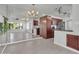 Open-concept kitchen with stainless steel appliances, ample cabinet space, and stylish lighting fixtures at 1001 N Pasadena Dr # 105, Mesa, AZ 85201