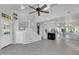 Open living space with a staircase, tile floors, fireplace, and natural light creating a welcoming atmosphere at 1001 N Pasadena Dr # 105, Mesa, AZ 85201