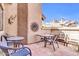 Outdoor patio with desert decor, red tile, and an outdoor dining set for entertaining at 1001 N Pasadena Dr # 105, Mesa, AZ 85201