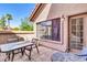 Outdoor patio with red tile, patio dining set, and shade from the desert sun at 1001 N Pasadena Dr # 105, Mesa, AZ 85201