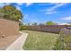 Nice back yard with green grass, block fence, with sidewalk and plants at 101 W 8Th Pl, Mesa, AZ 85201