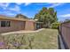 This well-manicured backyard offers a private retreat with lush greenery and flowering plants at 101 W 8Th Pl, Mesa, AZ 85201