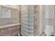 Well-lit bathroom features a glass block shower, granite vanity, and modern fixtures at 101 W 8Th Pl, Mesa, AZ 85201