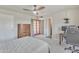 Bright bedroom featuring neutral tones, ceiling fan, and a charming door to the outdoors at 101 W 8Th Pl, Mesa, AZ 85201