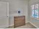 This carpeted bedroom has a dresser and bright window, creating a cozy atmosphere at 101 W 8Th Pl, Mesa, AZ 85201