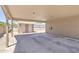 Spacious carport with a storage shed and a wall charger for an EV at 101 W 8Th Pl, Mesa, AZ 85201