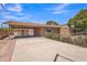 Exterior of home featuring a large carport with a spacious driveway at 101 W 8Th Pl, Mesa, AZ 85201