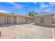 View of home featuring large carport, storage shed and brick walkway at 101 W 8Th Pl, Mesa, AZ 85201