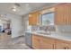 Well-lit kitchen featuring stainless steel appliances, updated countertops, and stylish tile flooring at 101 W 8Th Pl, Mesa, AZ 85201