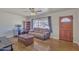 Bright living room with hardwood floors, large window, and a cozy seating area at 101 W 8Th Pl, Mesa, AZ 85201
