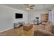 Spacious living room featuring modern entertainment setup and hardwood floors at 101 W 8Th Pl, Mesa, AZ 85201