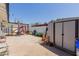 Spacious backyard featuring a basketball hoop, shed, and playset at 1017 S San Jose Cir, Mesa, AZ 85202